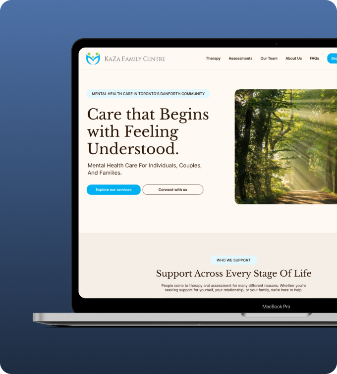 Website homepage of Kaza Family Centre on a MacBook Pro screen, offering mental health care in Toronto’s Danforth community with options to explore services or connect, alongside a forest path image.